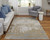 13' X 20' Ivory Gray and Brown Abstract Power Loom Worn Faded Area Rug