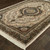 5' X 8' Ivory Black And Tan Medallion Area Rug With Fringe