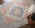 8' X 10' Red Blue and Ivory Abstract Hand Woven Distressed Area Rug With Fringe