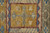 5' X 8' Blue Red and Yellow Wool Geometric Hand Knotted Area Rug With Fringe