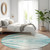 8' Teal And Ivory Abstract Washable Round Rug With UV Protection