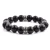 CRUCIBLE STAINLESS STEEL POLISHED ONYX TRIBAL BEADED STRETCH BRACELET (12MM)