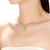 Collette Z Sterling Silver Oval Ice Blue Cubic Zirconia Solitaire with Halo Necklace