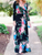 SURPLICE NECK BELTED FLORAL MAXI DRESS
