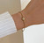 DELILAH GOLD DAINTY SOLITAIRE BIRTHSTONE BRACELET - APRIL