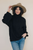 Hand In Hand Turtleneck Sweater