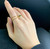 NAOMI GOLD TWIST SOLITAIRE RING