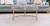 Set of Two Gold Glass Round Nested Coffee Tables
