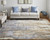 2' X 3' Brown Blue And Ivory Abstract Power Loom Distressed Area Rug