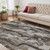 5' X 8' Brown and Ivory Abstract Power Loom Distressed Area Rug