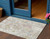 3' X 5' Ivory Beige And Linen Floral Washable Indoor Outdoor Area Rug