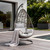 40" Dark Gray Aluminum Outdoor Rocking Egg Chair with White Cushion