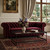 32" Clear and Black Mirrored Glass and Iron Sled Coffee Table With Two Shelves
