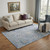 5' X 8' Sky Blue Beige And Purple Floral Washable Area Rug With UV Protection