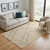 5' X 8' Beige And Blue Jute Abstract Hand Woven Area Rug