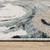 5' X 8' Blue Black And Ivory Abstract Area Rug With Fringe