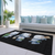5' X 8' Black Denim Blue And Ivory Snowmen Washable Indoor Outdoor Area Rug