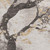 10' X 14' Beige Gold And Charcoal Floral Washable Area Rug With UV Protection
