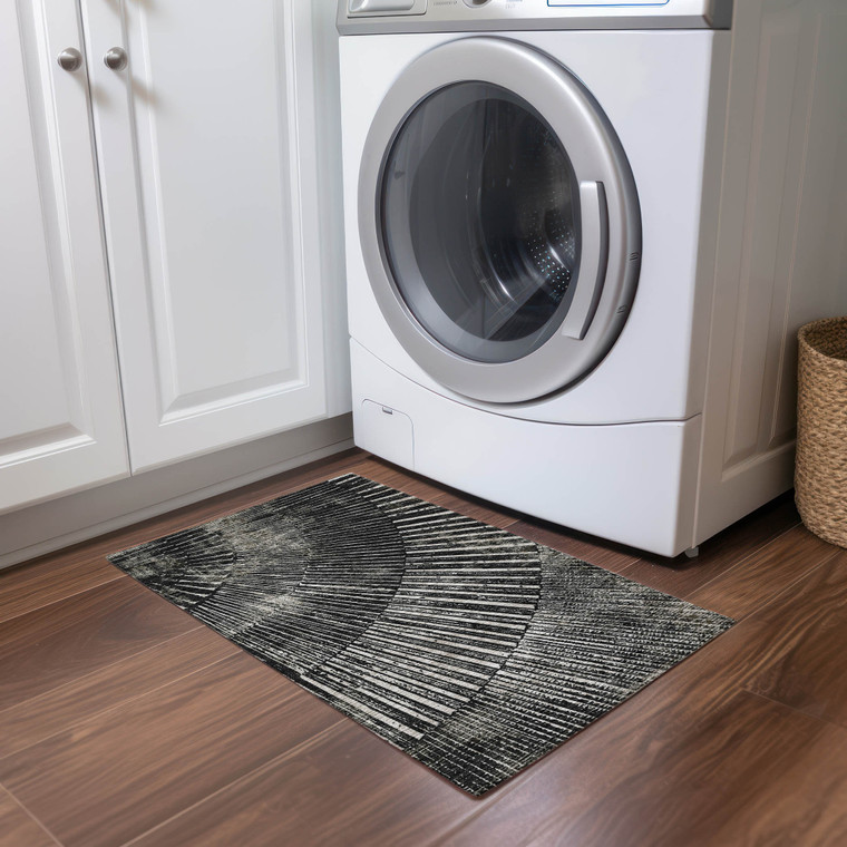 2' X 3' Black and Ivory Abstract Washable Non Skid Indoor Outdoor Area Rug