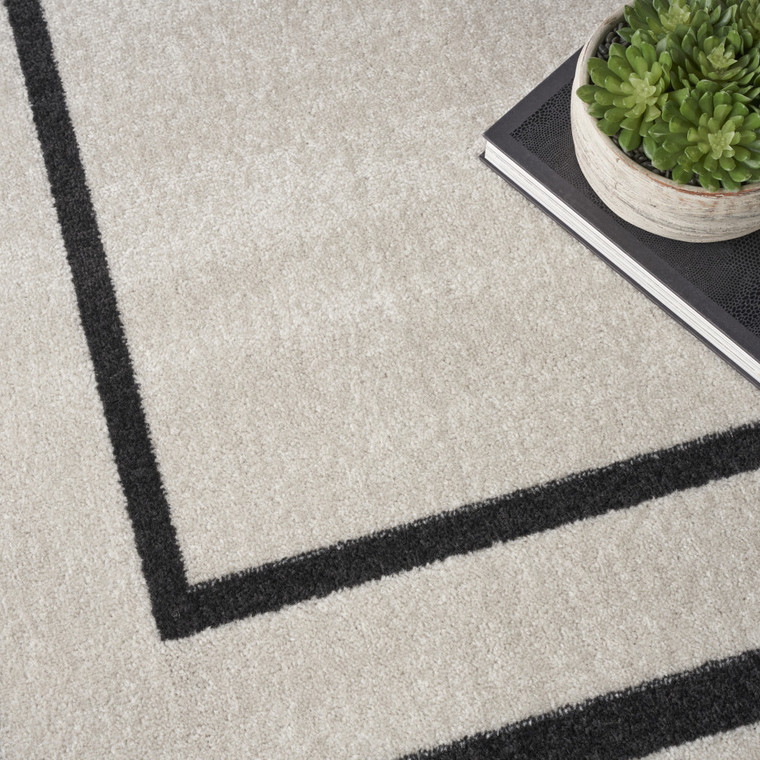 8' X 10' Ivory And Black Indoor Outdoor Area Rug