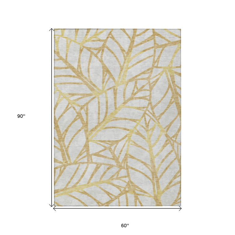 5' X 8' Gold And Beige Floral Washable Indoor Outdoor Area Rug