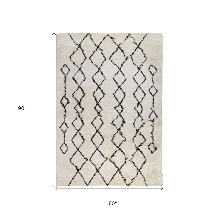 5' X 8' Ivory And Black Geometric Shag Area Rug