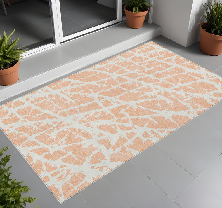 3' X 5' Peach and Ivory Abstract Washable Non Skid Indoor Outdoor Area Rug
