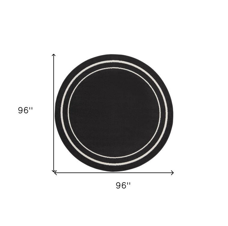 8' Black And Ivory Round Indoor Outdoor Area Rug