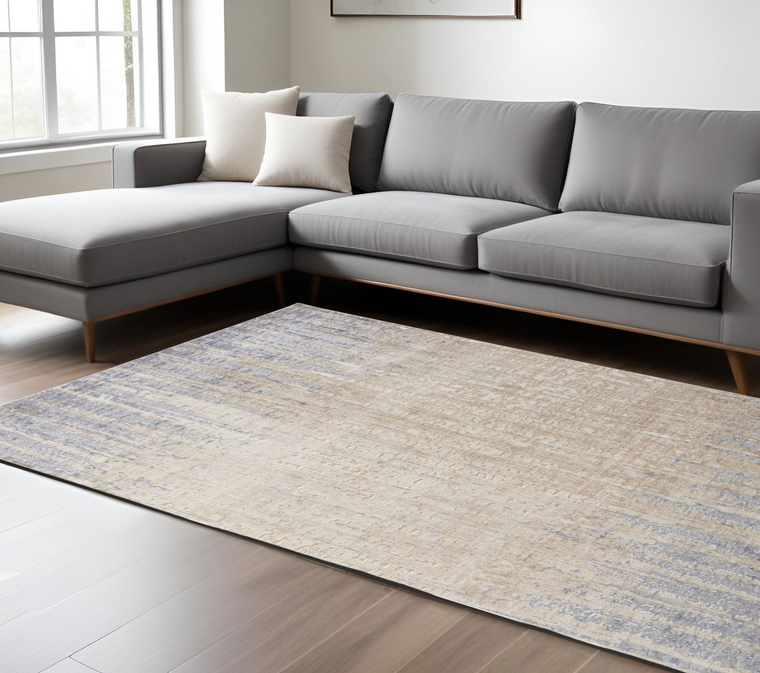 8' X 10' Tan And Blue Abstract Distressed Area Rug