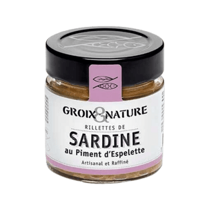Exquisite Sardine Rillettes with Espelette Pepper by Groix et Nature, Brittany, France. Glass jar with white label and hints of pink, showcasing locally-made rillettes with the perfect balance of tender sardines and smoky Espelette pepper.