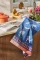 Jacquard cotton tea towel featuring assorted dog breed silhouettes woven on a rich blue background.