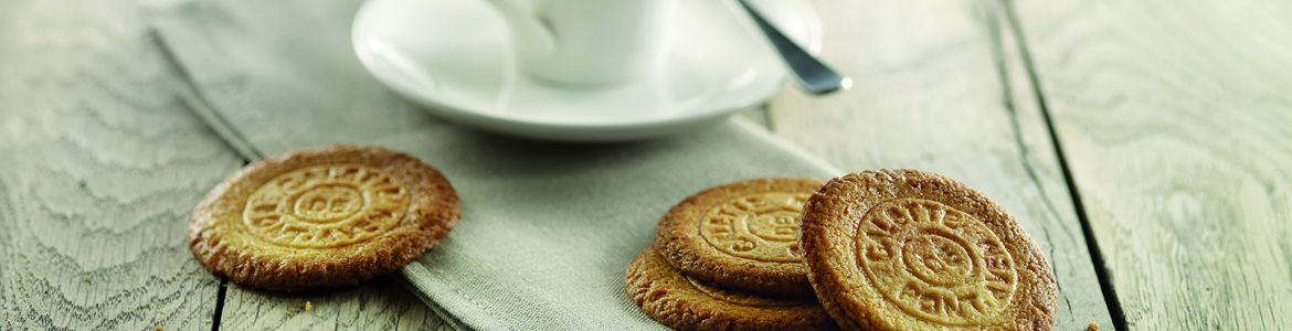 beauty shot of wafer cookies with a teacup and saucer