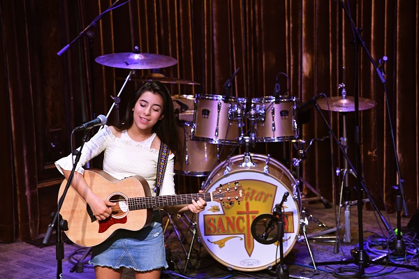 a person playing a guitar