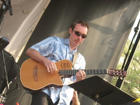 a man playing a guitar