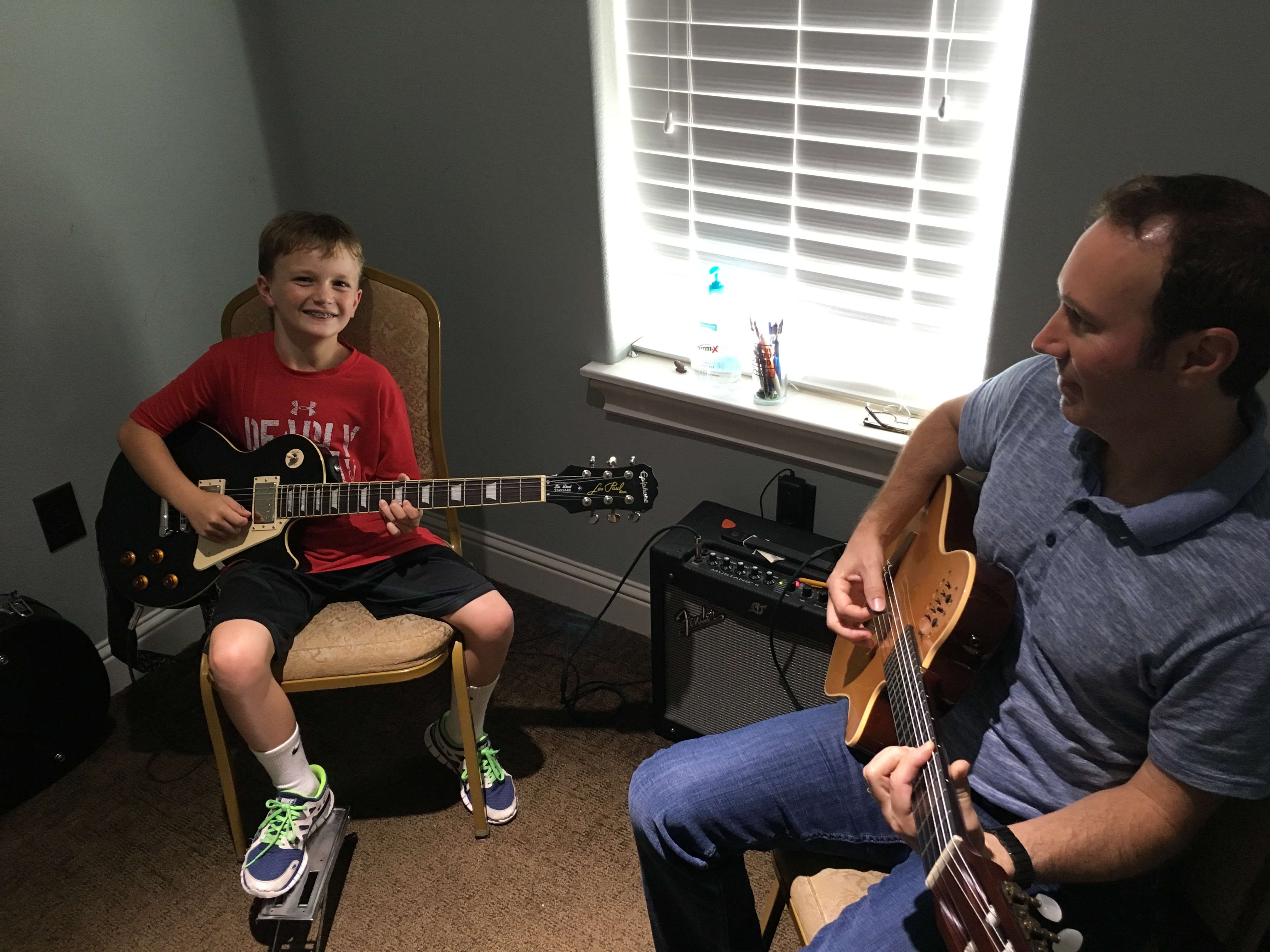 a group of men playing guitars