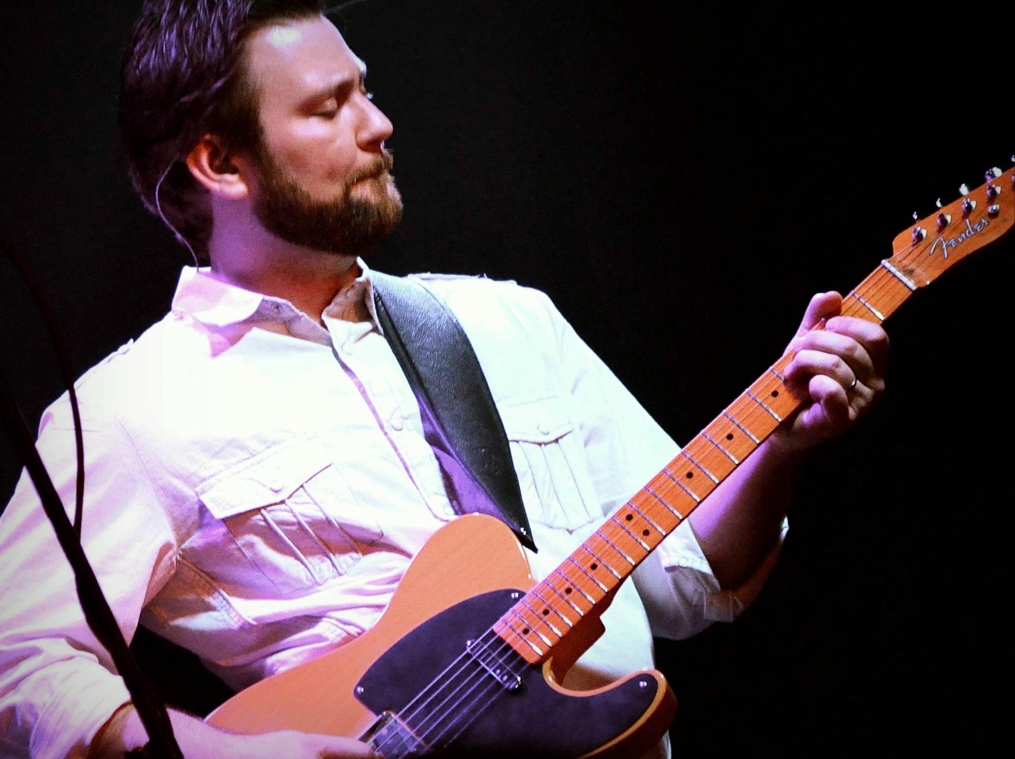 a man playing a guitar