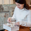 Simply the Best Gift Box - Woman opening the box