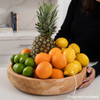 Serving Bowl with Fruit Displayed and woman's hand