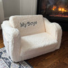 Sherpa Mini Sofa in front of fireplace