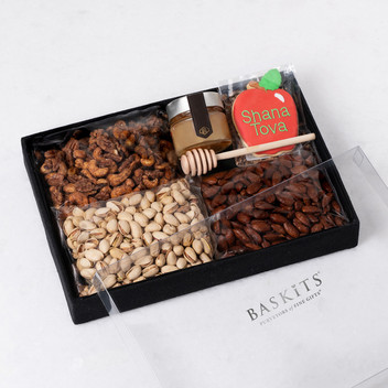 Sweet Harvest Nut Tray with Nuts, cookie, and honey.
