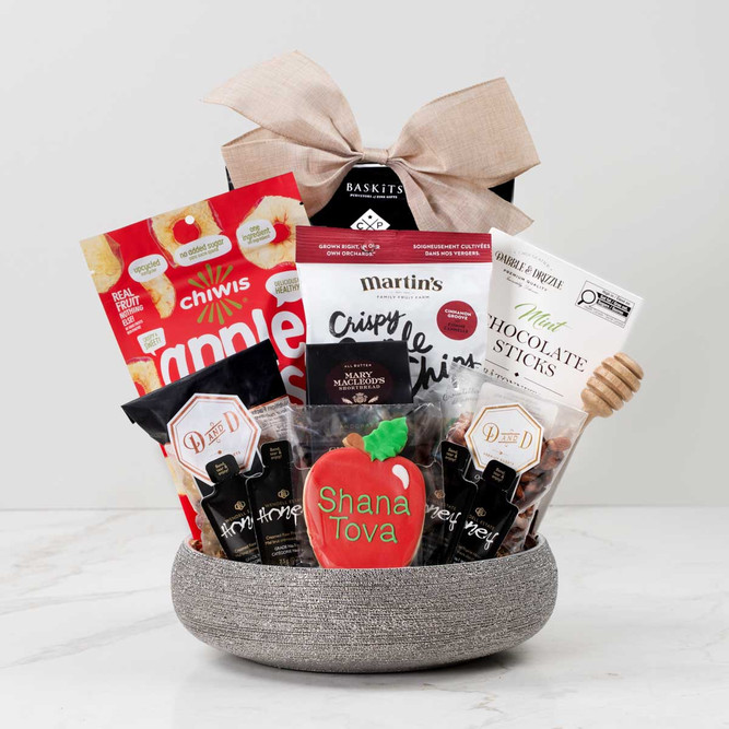 Shana tova gift basket featuring gourmet treats and cookie.