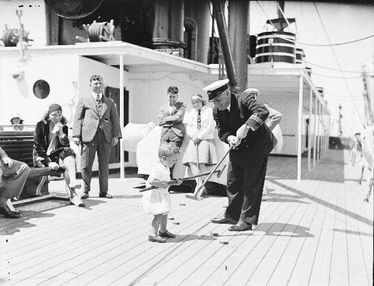Ship's Captain Playing Deck Game with Child