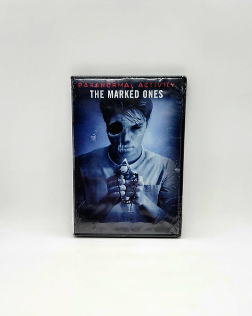Paramount Paranormal Activity: The Marked Ones [DVD], DVD case featuring a young man with a skull-like face, holding prayer beads and a pendant, with a dark and eerie background.