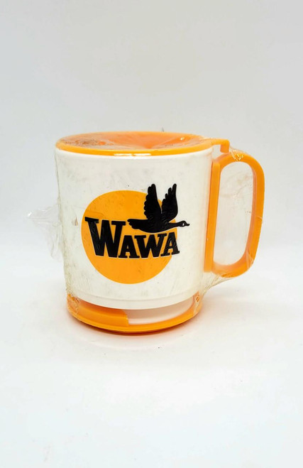 WAWA Vintage WAWA Plastic Travel Coffee Mug, white mug with orange handle and base, featuring the WAWA logo with a black flying goose against a yellow circle.