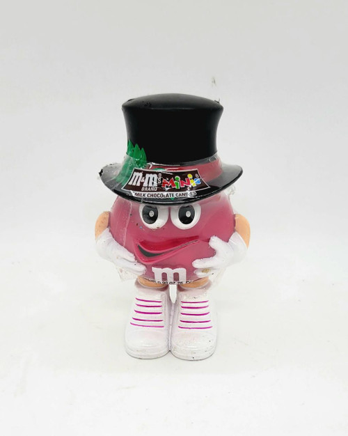M&M's Minis Candy Dispenser - Christmas Top Hat, pink character designed as an M&M with a black top hat and white shoes, holding a candy.