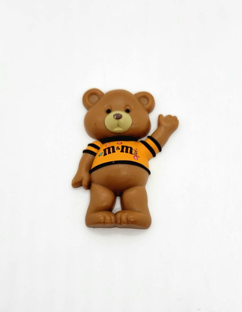M&M's Plastic Bear Magnet, cute brown bear figurine with M&M's branding on its shirt waving hand.