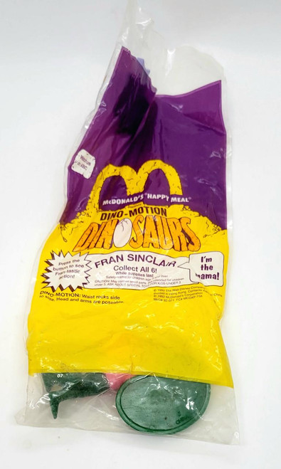 Dinosaurs McDonald's Happy Meal 1992 Dino-Motion Dinosaurs Fran Sinclair Toy Figure, collectible toy in original packaging with purple and yellow McDonald's themed design.