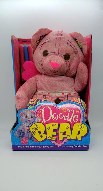 Tyco 1994 TYCO Doodle Bear - Happenin' Hearts, a pink plush teddy bear with tattooing details, buttons on its chest, and a heart-shaped patch on its side, packaged in a colorful box with doodle-themed graphics and accessories.