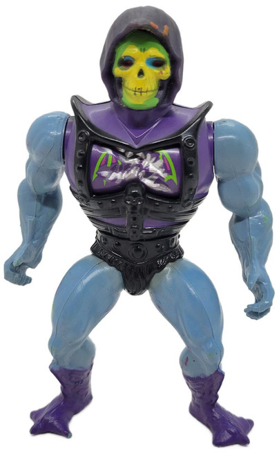 Masters of the Universe 1983 Battle Armor Damage Skeletor Action Figure, collectible toy with a skull face and purple and black armor.