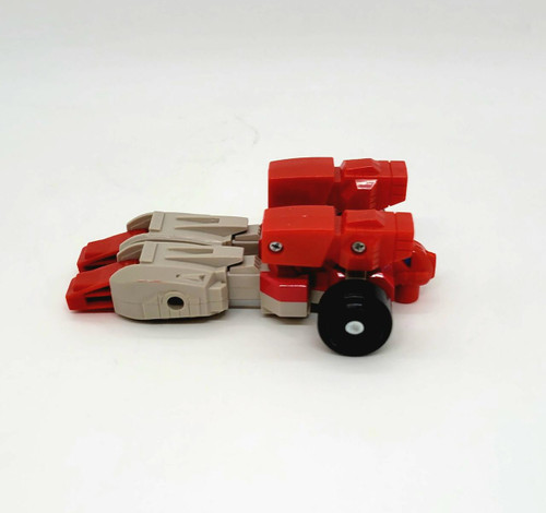 Transformers 1987 G1 Clones Fastlane Action Figure, toy vehicle in red and beige colors with black wheels, original vintage robot toy from the G1 series.